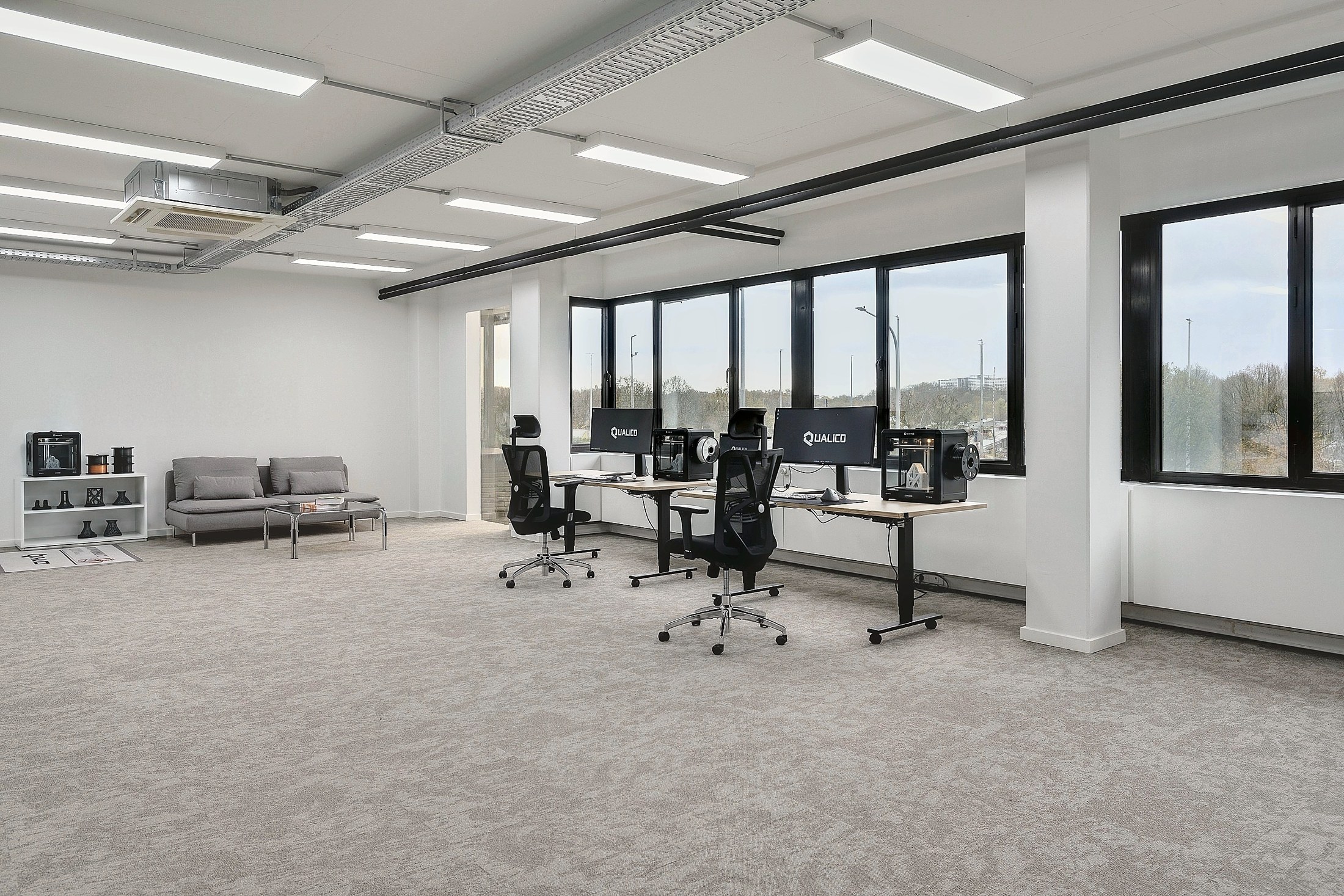 The Qualico studio's desks and meeting area