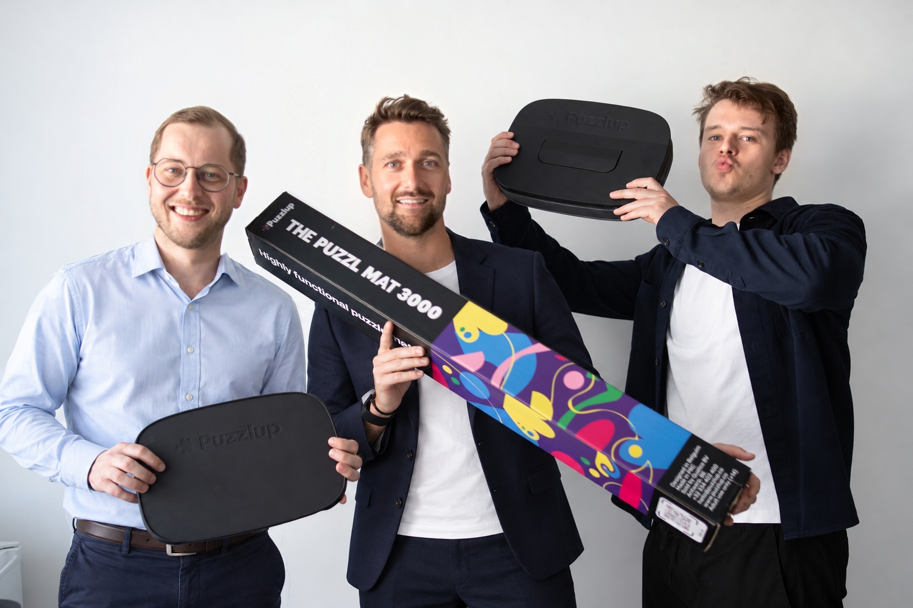 Three Qualico team members presenting Puzzlup products in the studio
